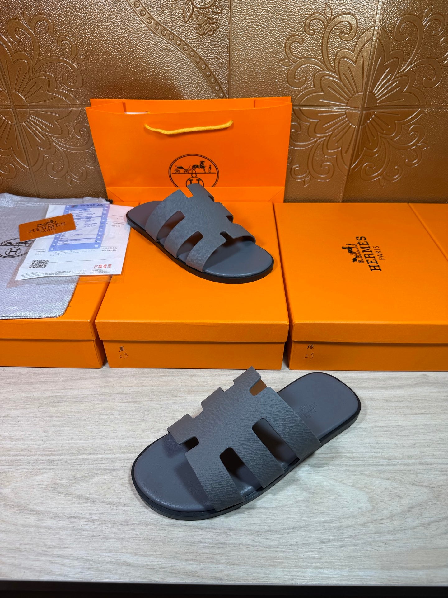 Hermes slide sandals in dark blue with open toe and stacked strap design