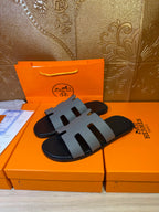 Hermes slide sandals, black base with light gray multi-strap design