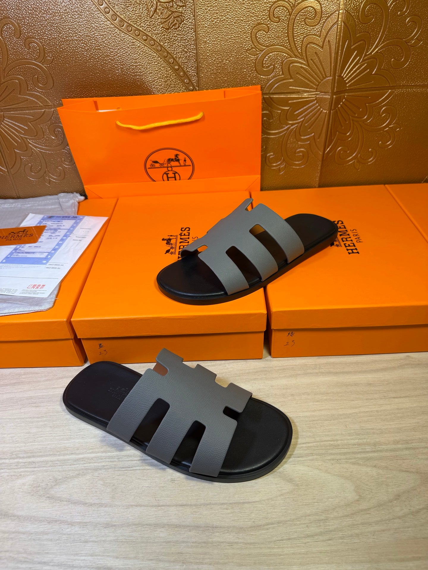 Hermes slide sandal, black footbed with light gray striped strap bands