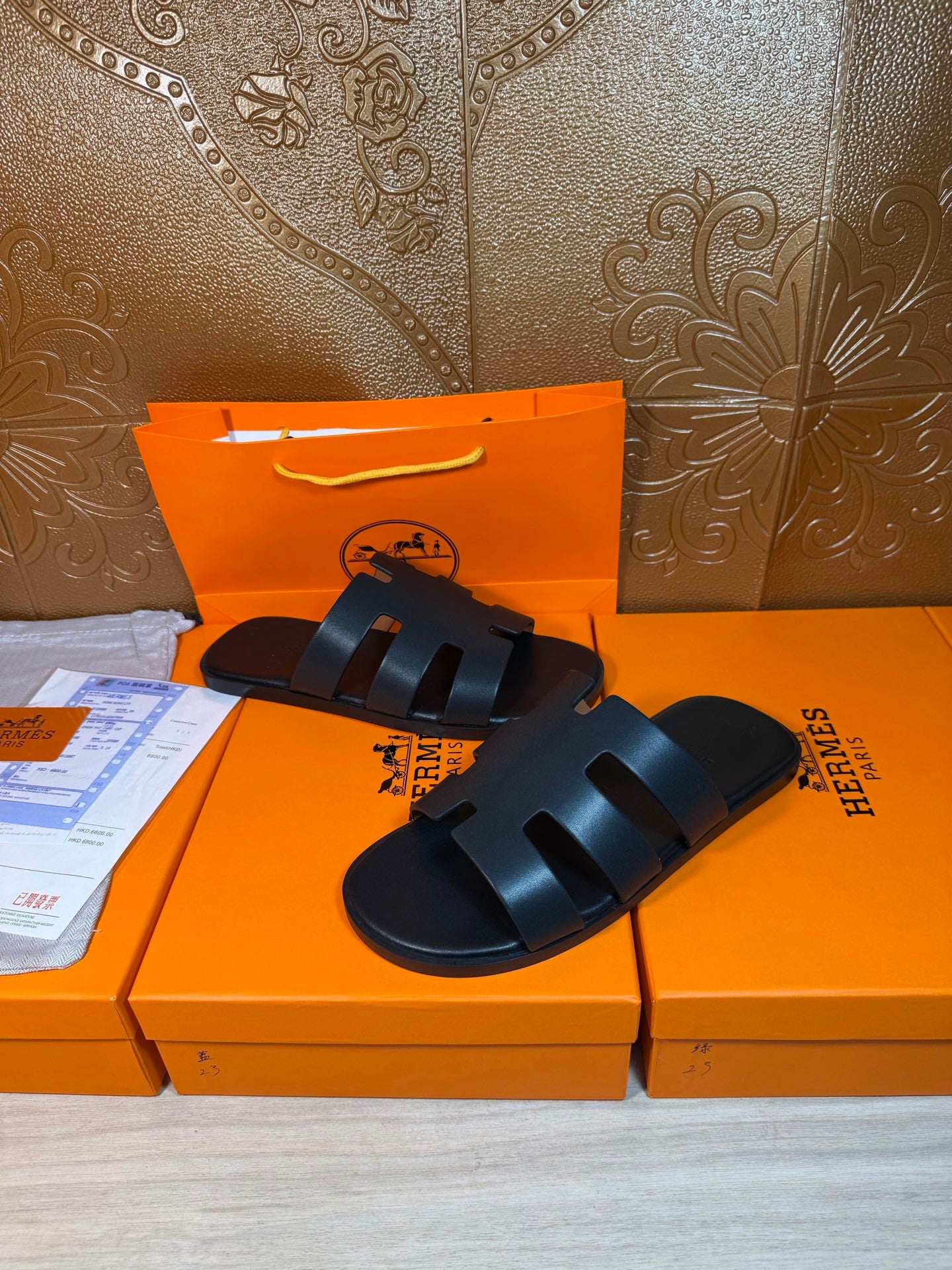 Hermes slide sandals, dark navy, thick straps crossing over the foot