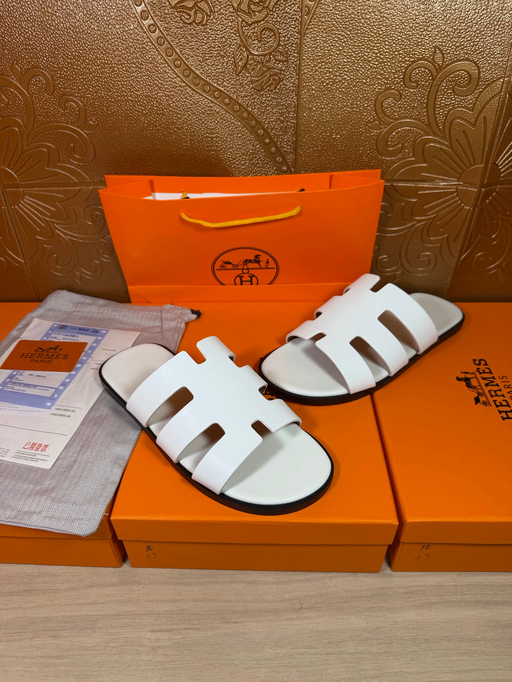 Hermes sandals with white multi-strap upper, open toe and curved sole