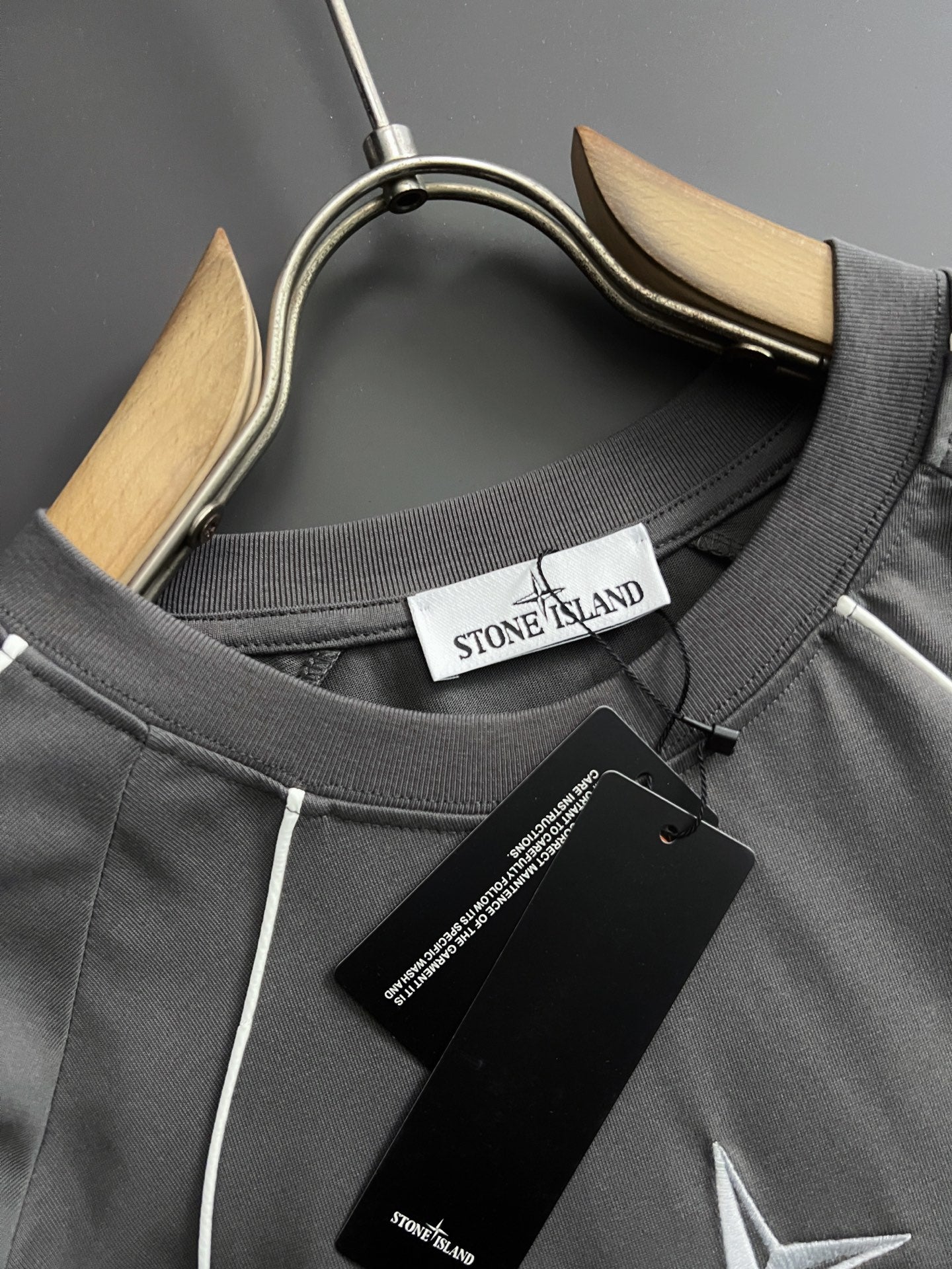Stone Island crew-neck T-shirt collar detail with inner neck label and tag