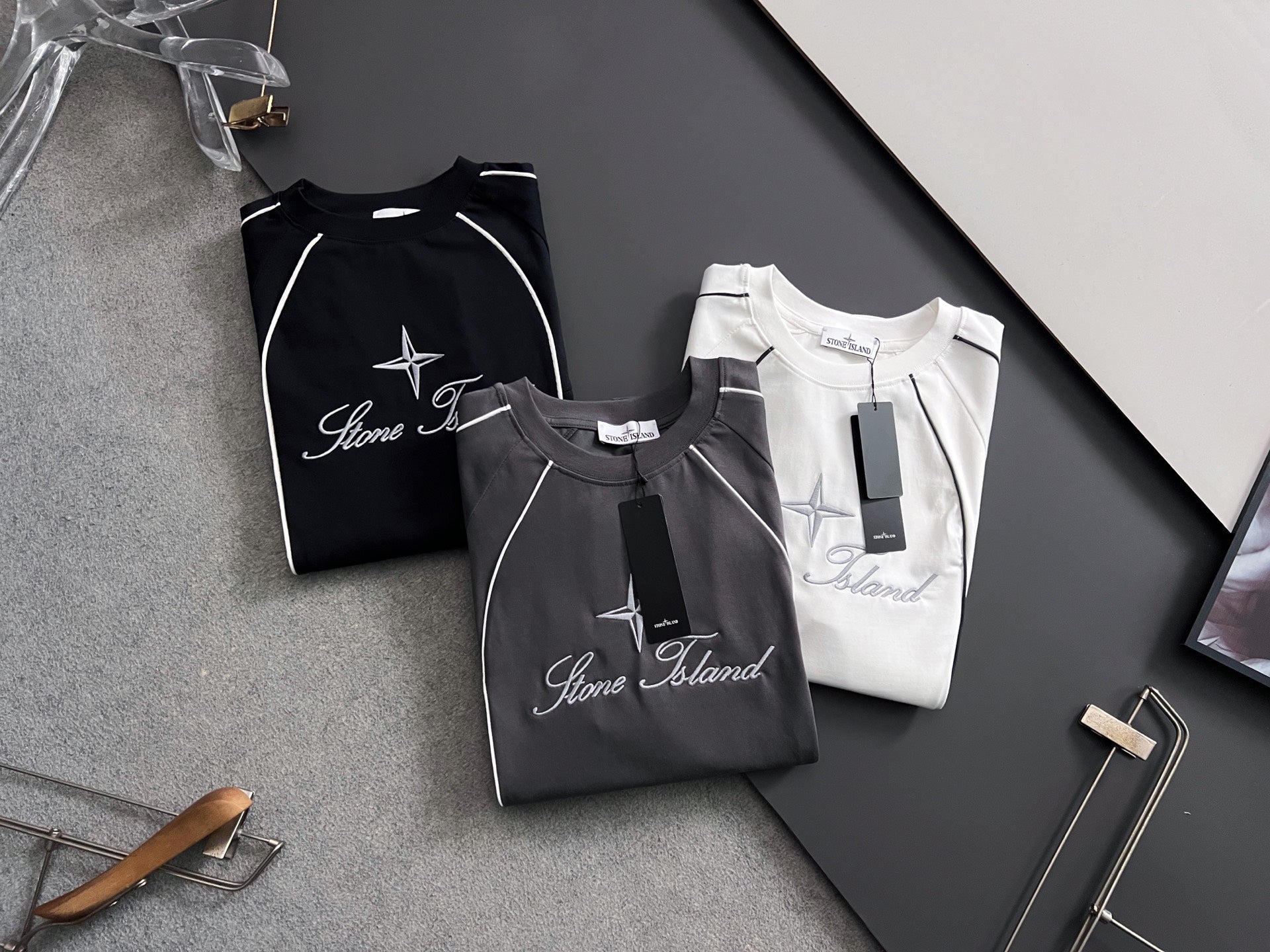 Stone Island black T-shirt with white star and script logo, short sleeves