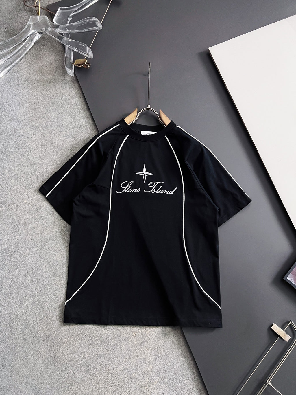 Stone Island black T-shirt with white piping seams and star script logo