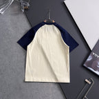 Cream T-shirt with navy raglan sleeves, no visible front graphic