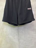 Black shorts with tapered hem and Balenciaga embroidered side logo
