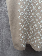 Light beige logo-print T-shirt close-up of side panel and lower hem