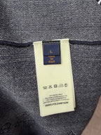 Louis Vuitton inner neck label on navy T-shirt, fabric tag and care info close-up