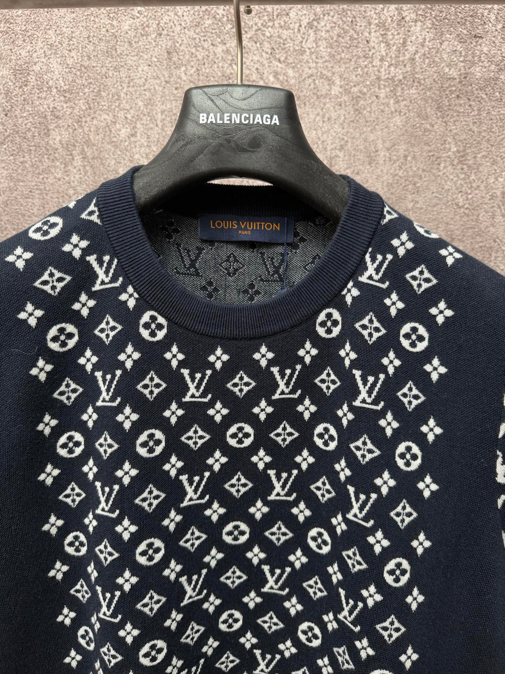 Louis Vuitton logo T-shirt neckline close-up, dark navy with white pattern across chest