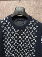 Louis Vuitton logo T-shirt neckline close-up, dark navy with white pattern across chest