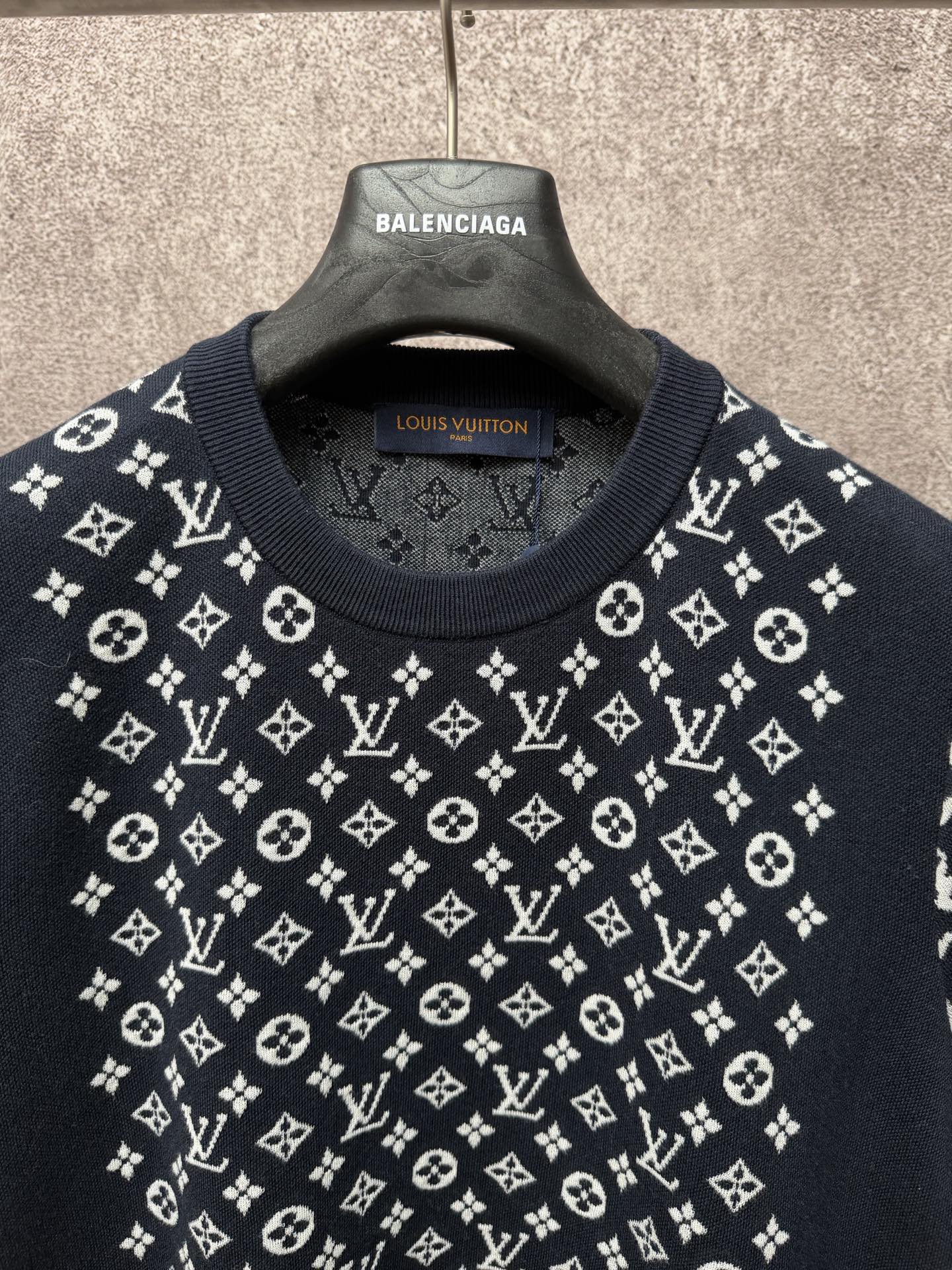 Louis Vuitton logo T-shirt neckline close-up, dark navy with white pattern across chest