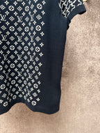 Louis Vuitton logo T-shirt fabric close-up, dark navy knit with white monogram pattern