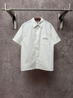 White short-sleeve button-up shirt with pointed collar and chest pocket, Diorbling script