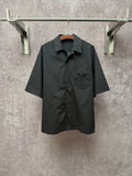 Louis Vuitton short-sleeve button-up shirt, dark black, chest logo patch