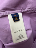 Inside neck label on lavender shirt: size XL, Made in Italy, care icons