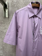Men's short-sleeve button-up shirt in lavender with spread collar and buttons