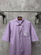 Men's short-sleeve button-up shirt in lavender with chest logo on pocket