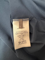 T-shirt care label with 100% cotton composition and Made in Italy