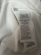 White Gucci T-shirt care label on inner collar