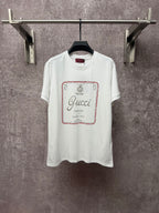 White Gucci short-sleeve T-shirt with red-bordered front logo print