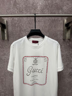 White Gucci T-shirt with front square logo graphic and red outline