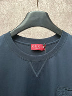 Dark navy short-sleeve T-shirt with Gucci neck label and V-neck stitching