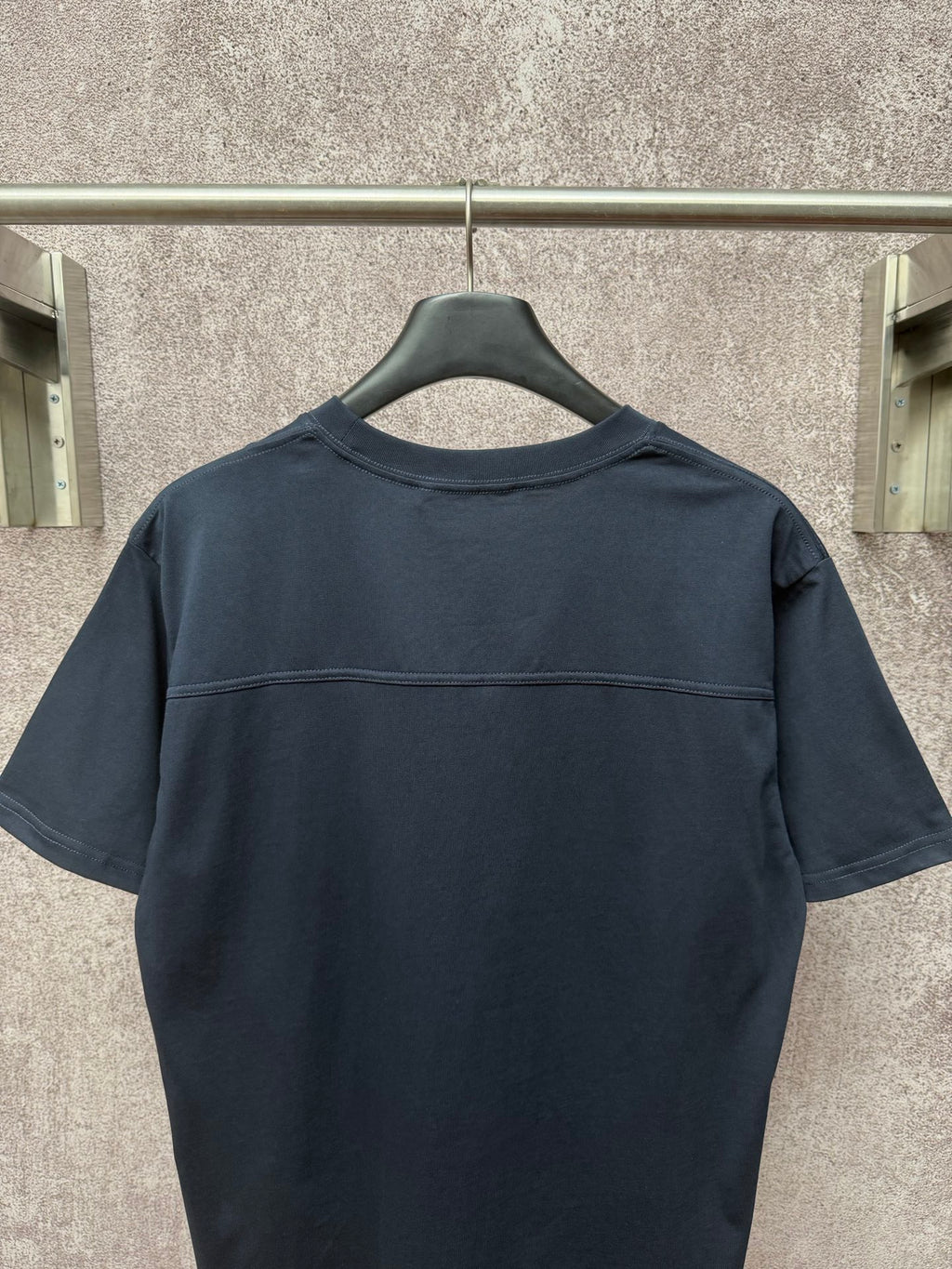 Dark navy short-sleeve T-shirt, back view with stitched yoke seam