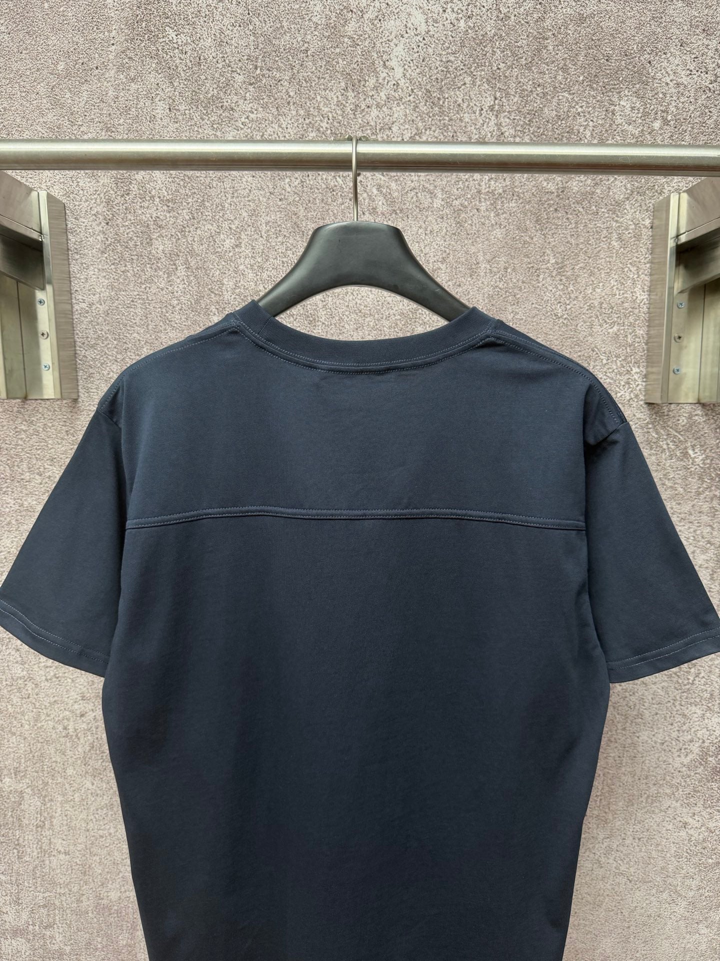 Dark navy short-sleeve T-shirt, back view with stitched yoke seam
