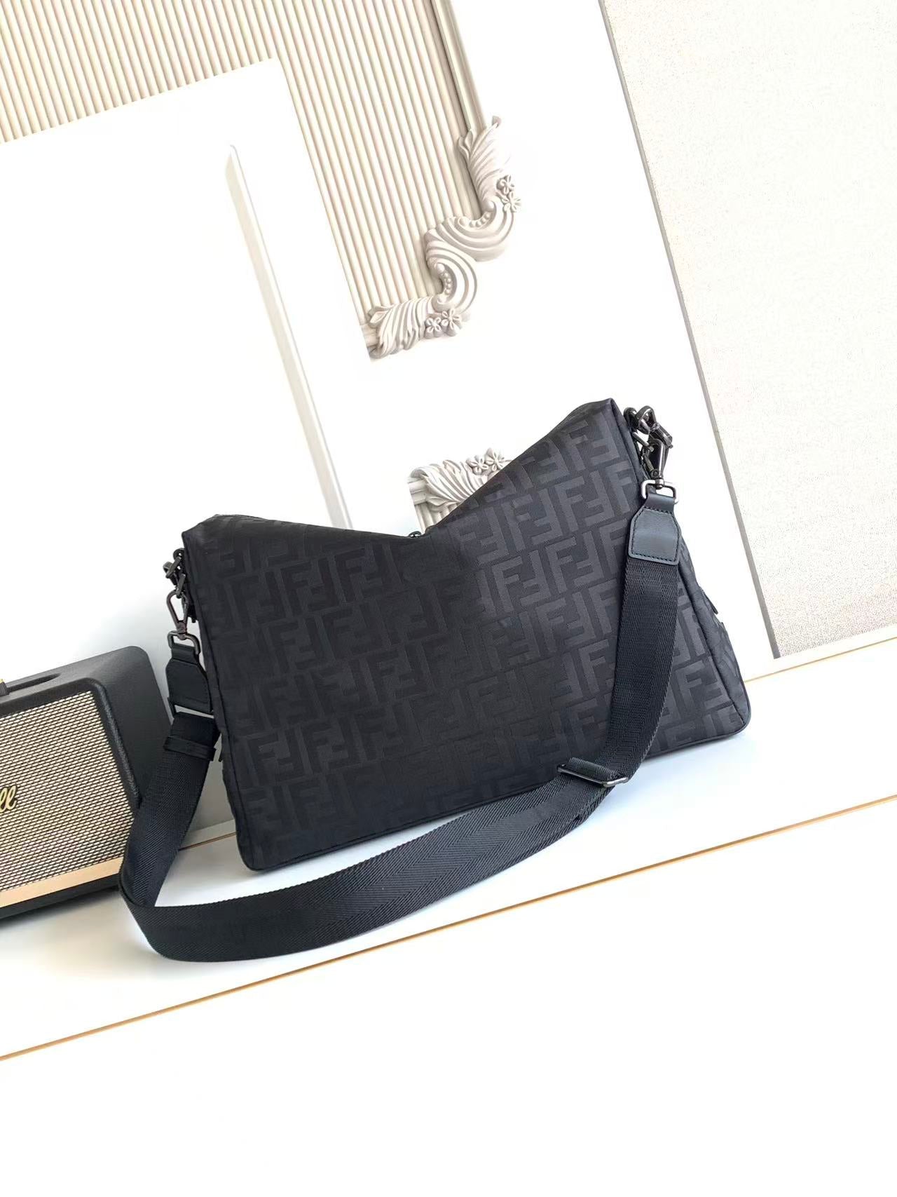 Fendi FF-pattern shoulder bag with top handle and crossbody strap