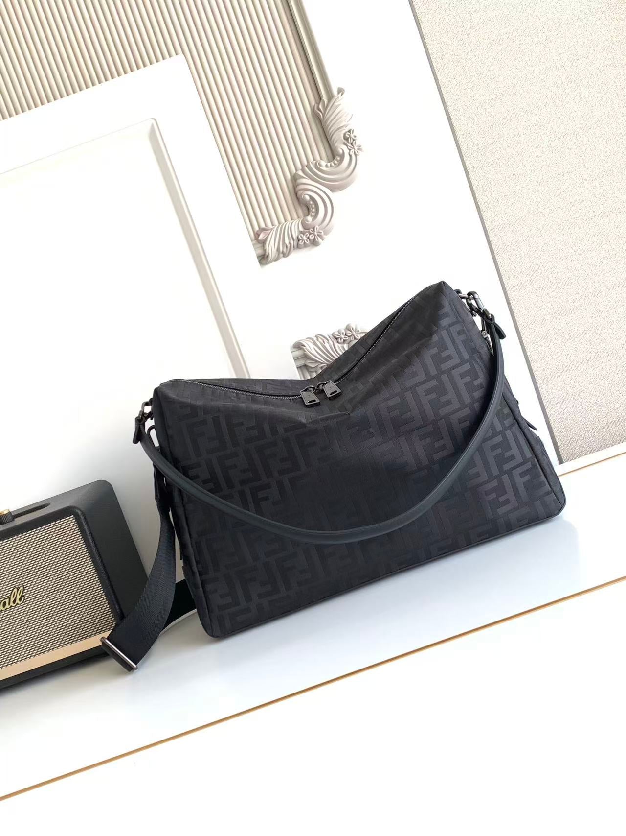 Fendi logo-printed shoulder bag with top zipper and crossbody strap