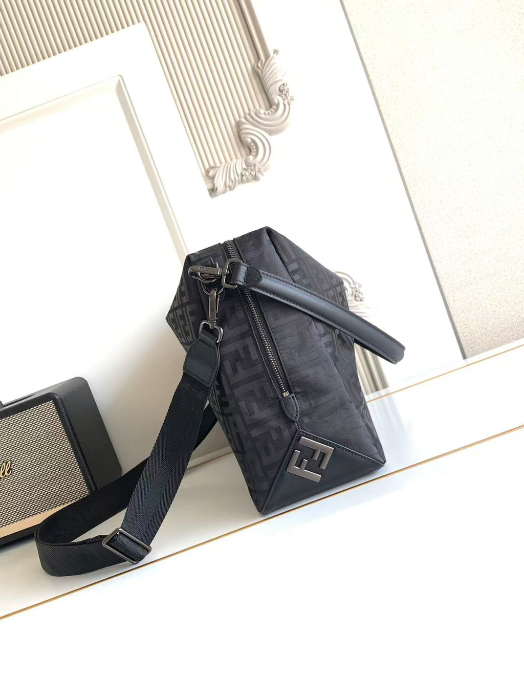 Fendi logo crossbody bag with zippered front and adjustable shoulder strap
