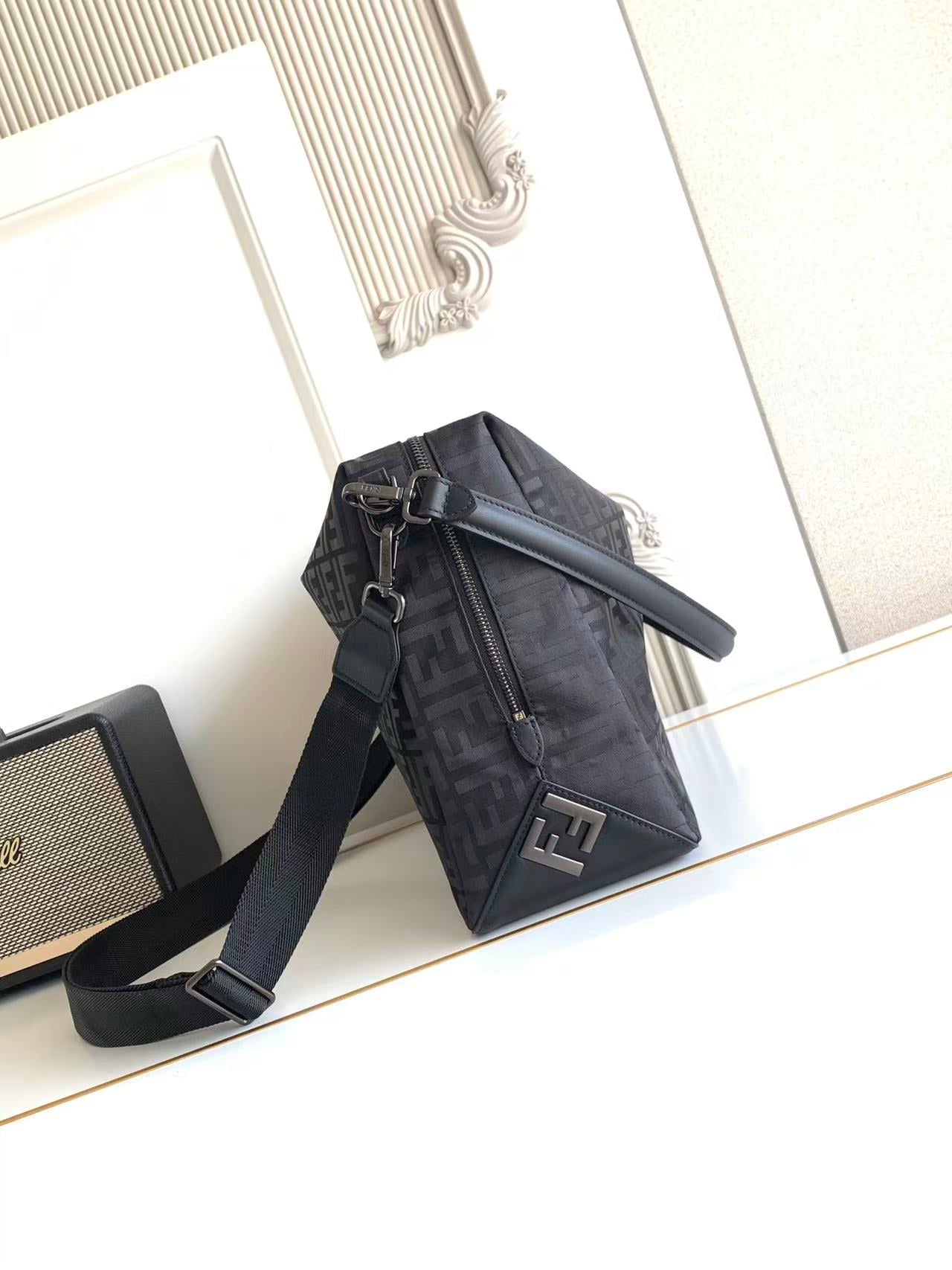 Fendi logo crossbody bag with zippered front and adjustable shoulder strap