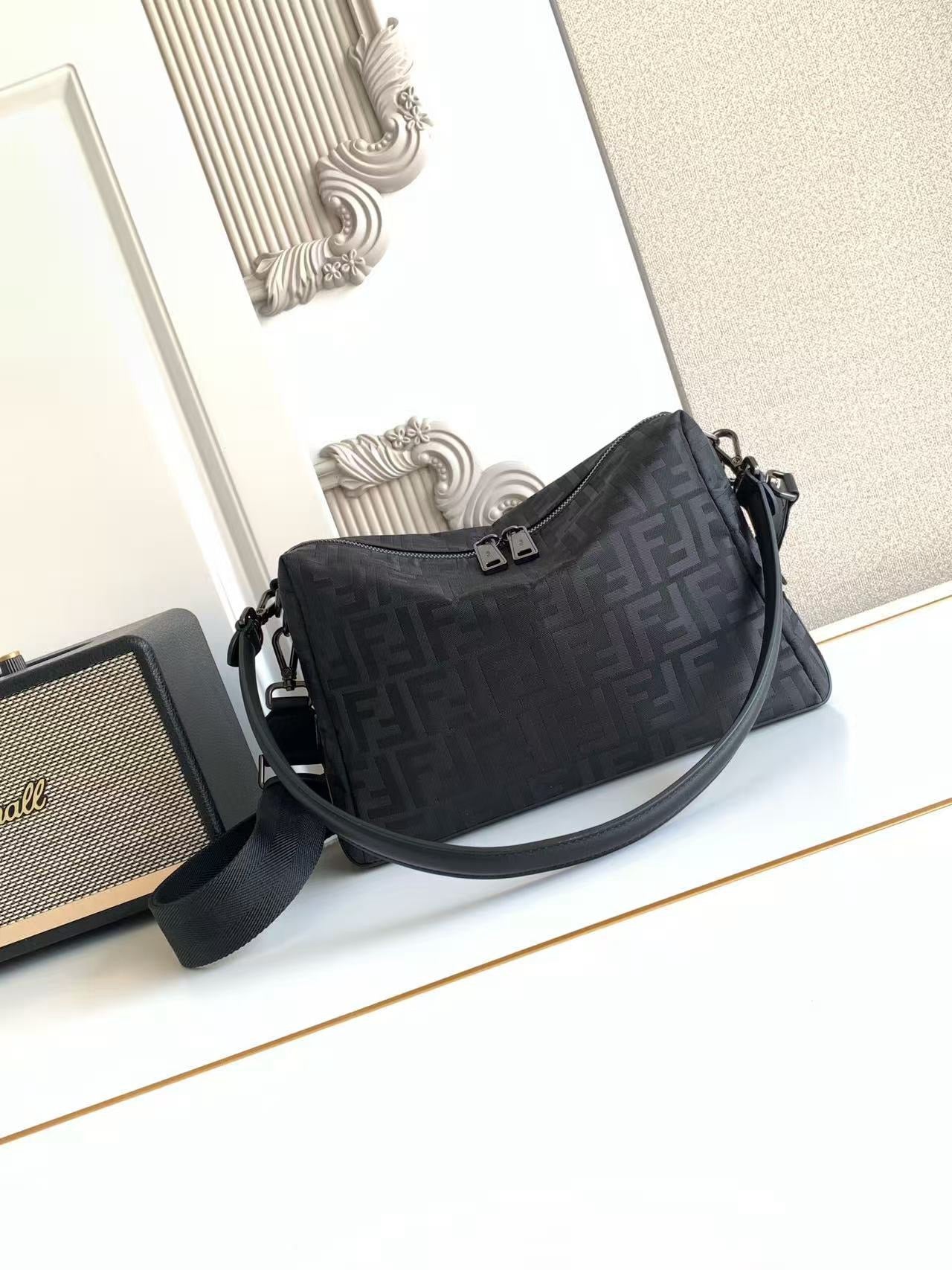 Fendi bag with long shoulder strap and front zipper, dark FF logo pattern