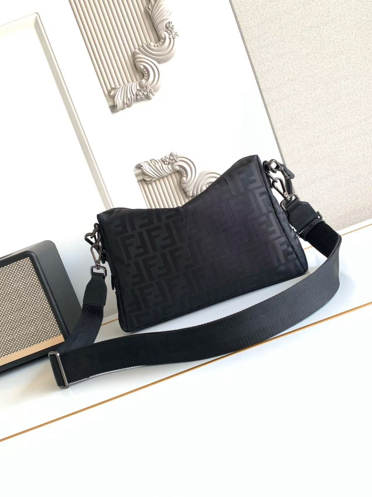 Fendi bag with long strap, dark FF logo canvas, side view with zipper edge
