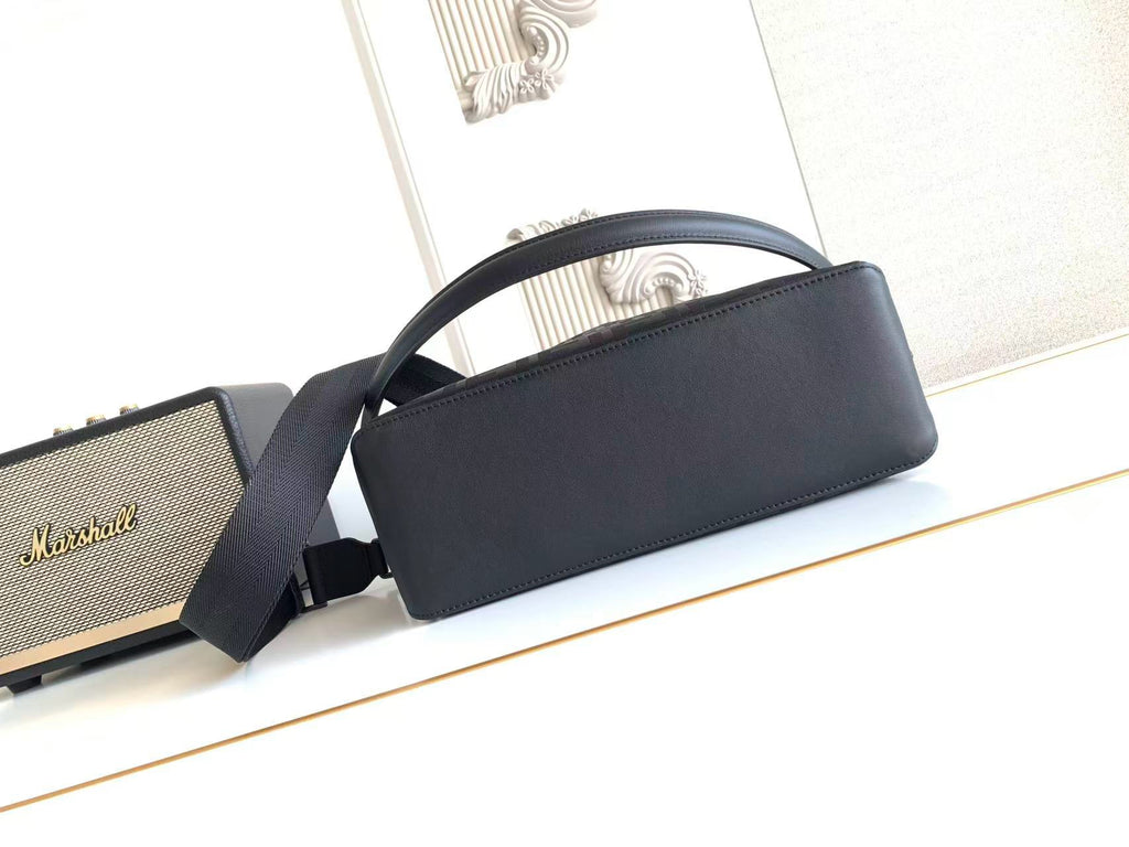 Fendi bag with structured top handle and strap, smooth dark front panel