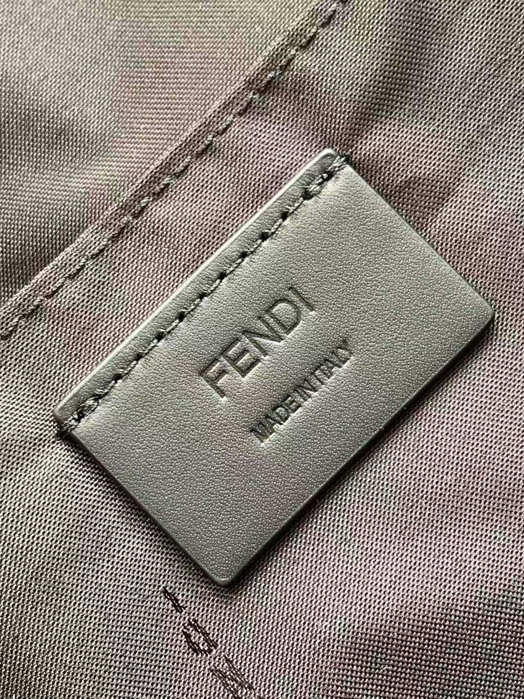 Fendi bag leather logo patch on gray fabric lining