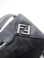 Fendi bag close-up of FF logo in silver on textured gray fabric