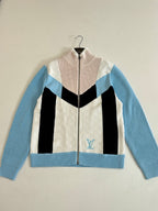 Louis Vuitton knit zip sweater with cream front, black stripe, light blue sleeves and LV emblem
