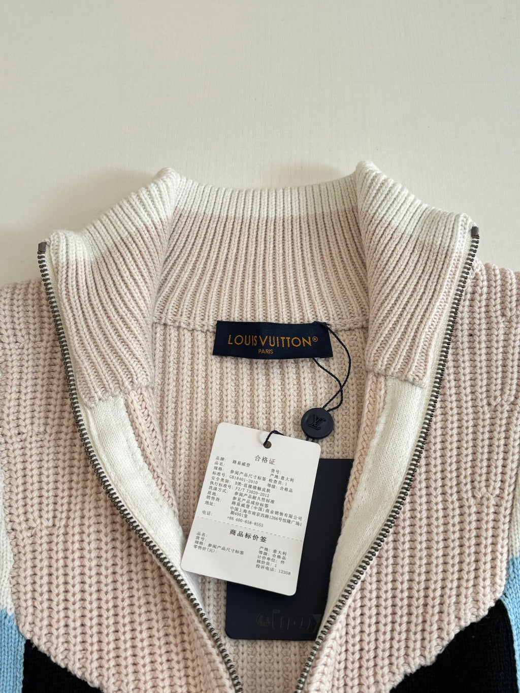 Louis Vuitton knit zip sweater collar and zipper tag on cream ribbed knit with black lining