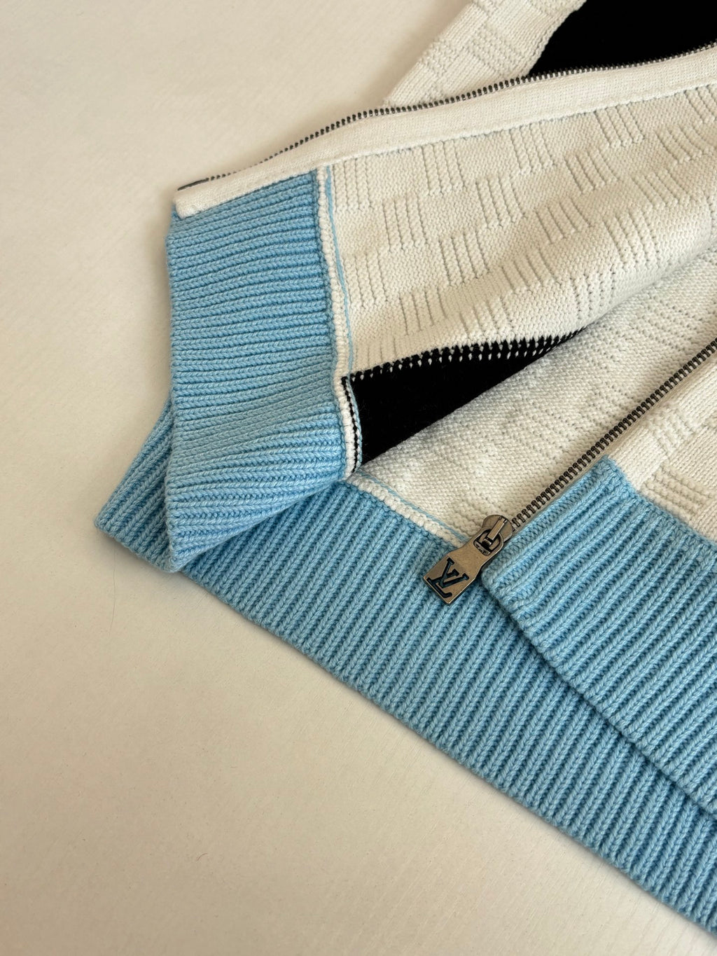 Louis Vuitton knit zip sweater close-up collar with black stripe and light blue edging