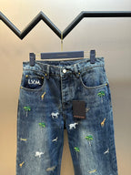 Blue denim pants with L.V.M. waistband patch and animal palm prints