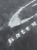 Balenciaga dark gray T-shirt fabric with white distressed “BALENCIAGA” letters