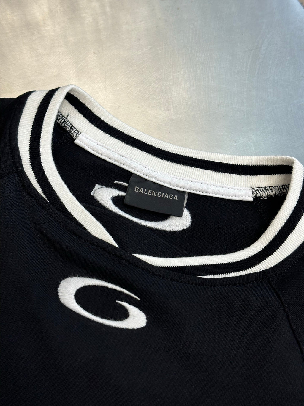 Balenciaga black jersey neckline with white and black striped trim and small front logo