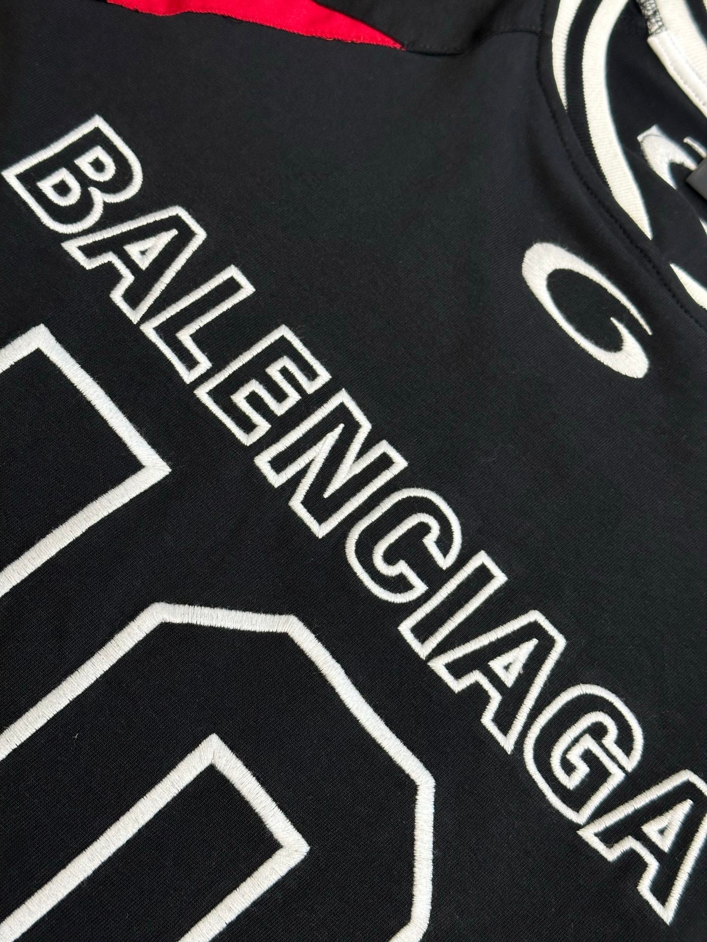 Balenciaga black jersey with BALENCIAGA white outlined text and 10-style number graphic