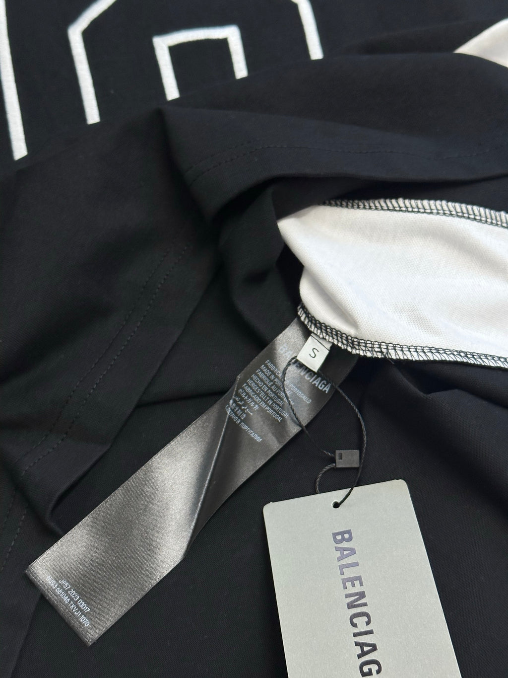 Balenciaga jersey collar with neck tag and stitched label on black fabric