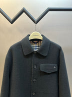 Burberry long-sleeve coat with chest pocket, dark buttons, and pointed collar