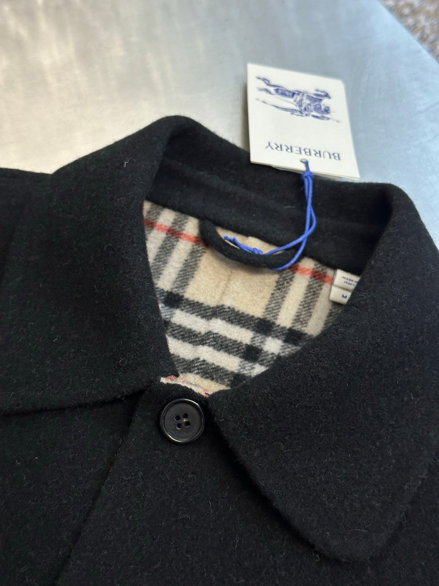 Burberry coat inner collar and button placket with plaid lining