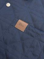 Quilted long jacket fabric with brown Dior logo patch on chest