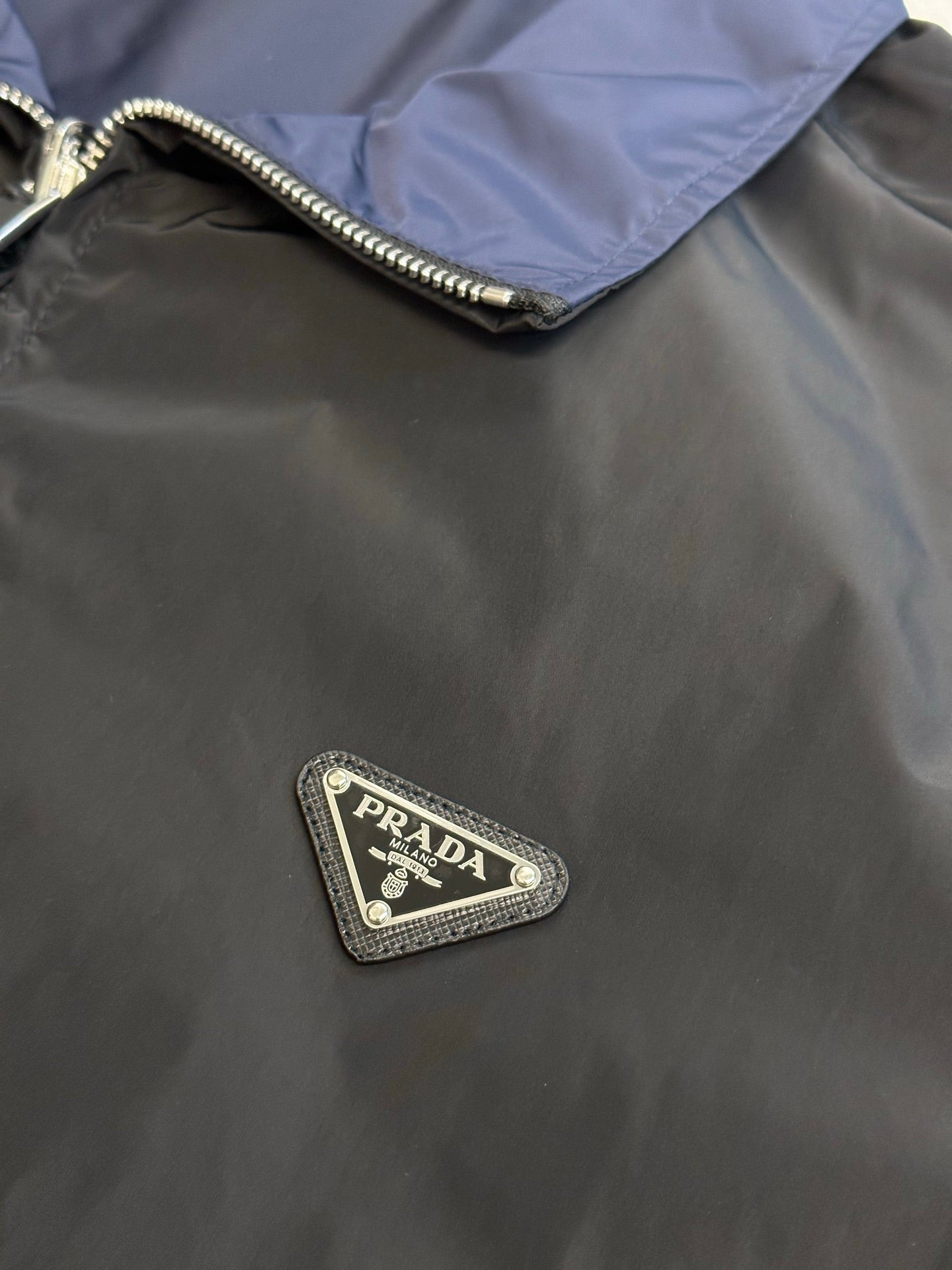 Prada long jacket chest logo patch and metal zipper trim