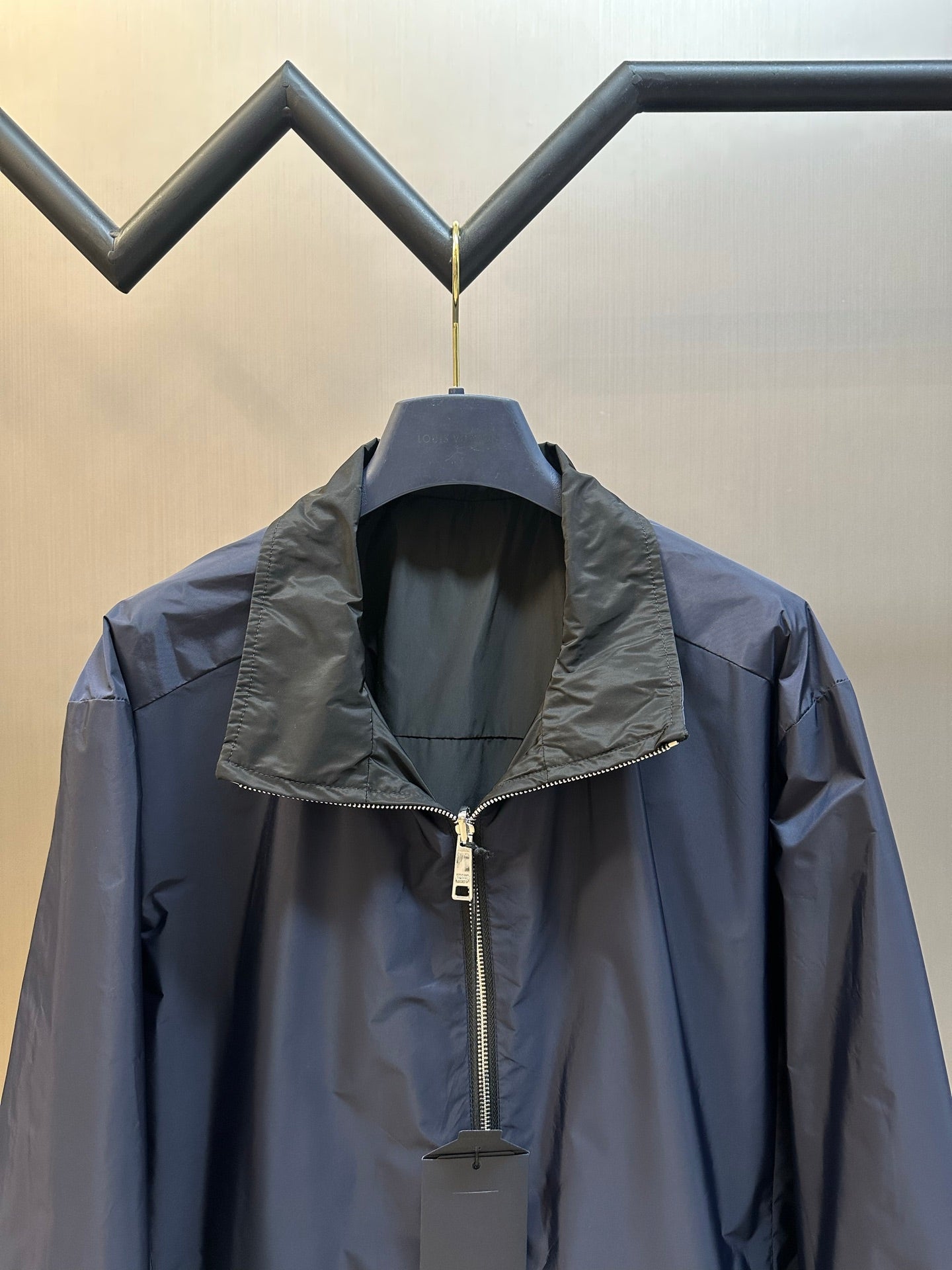 Prada long jacket with raised collar, front zipper, and hood detail